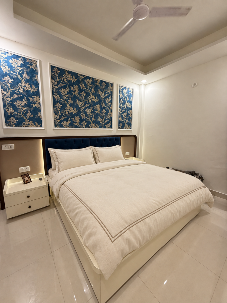 Bedroom with blue floral wallpaper headboard, Bijnor, Lucknow