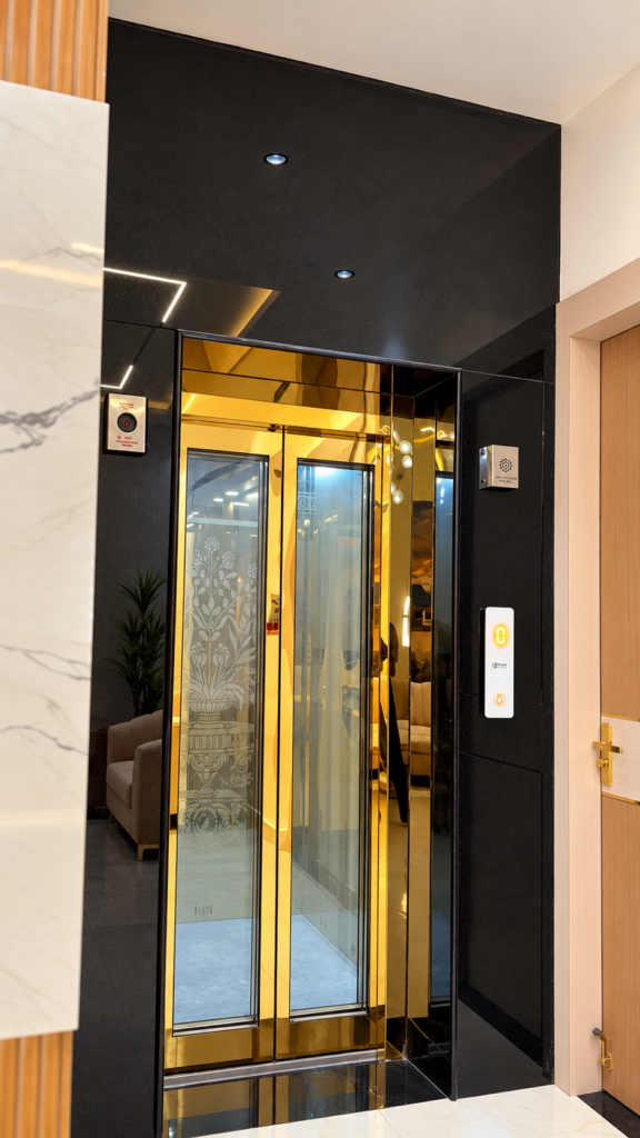 Home lift with black stone gold doors, Telibagh, Lucknow