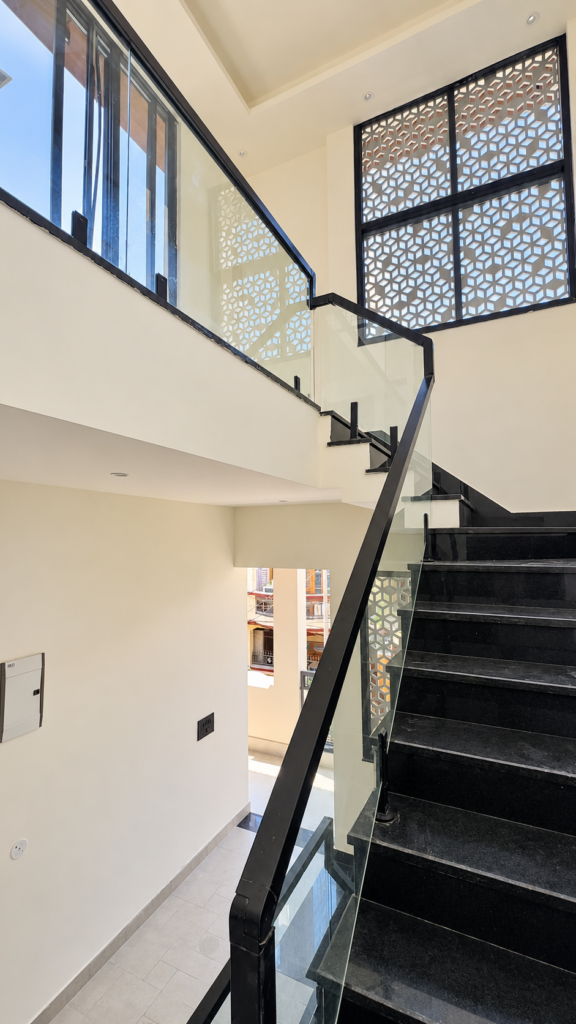 Interior staircase with black steps glass balustrade, Ashiyana Colony, Lucknow