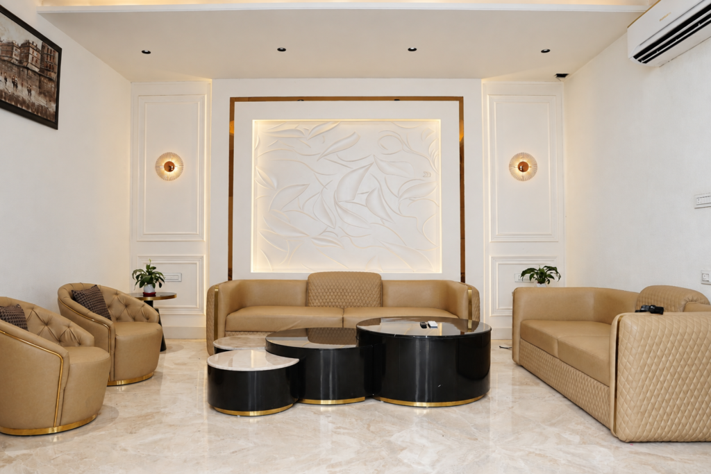 Living room with beige sofas accent wall, near CCS International Airport, Lucknow