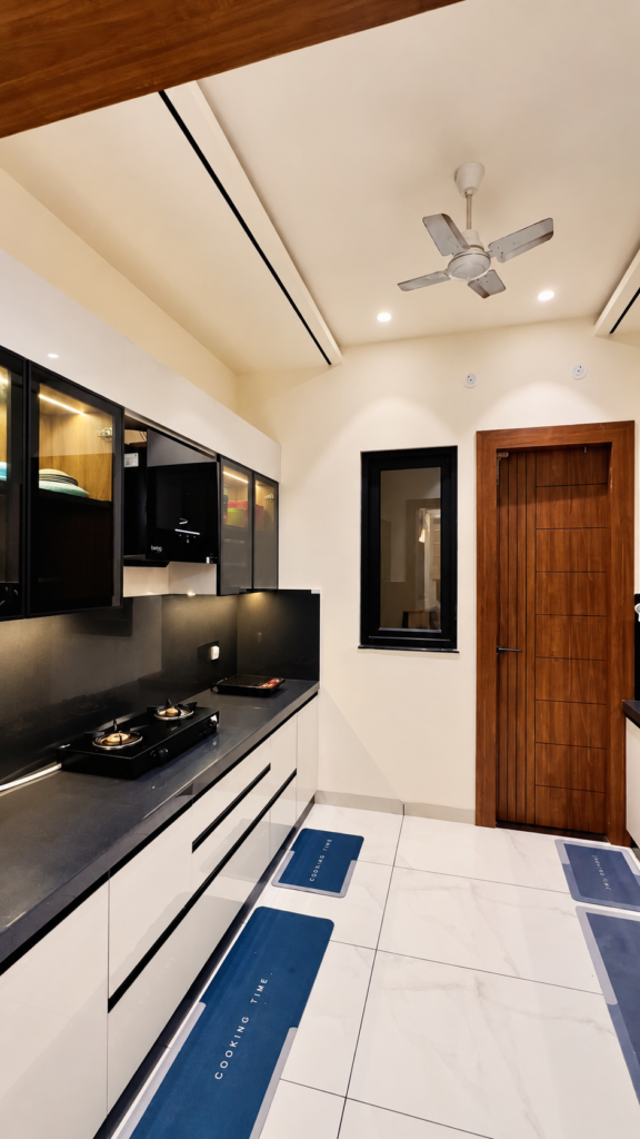 Modular kitchen with black countertop wood ceiling, Ashiyana Colony, Lucknow